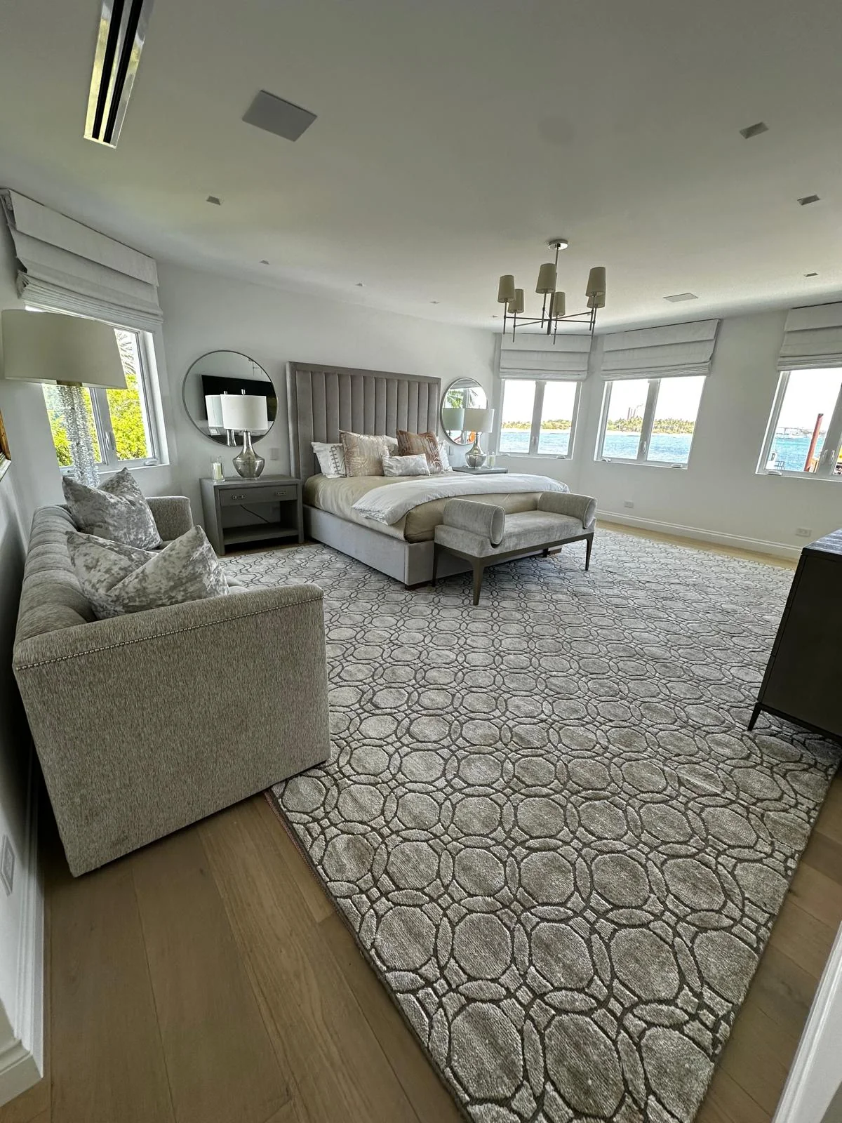 Waterfront luxury bedroom suite with flawless Level 5 smooth white wall and ceiling finish