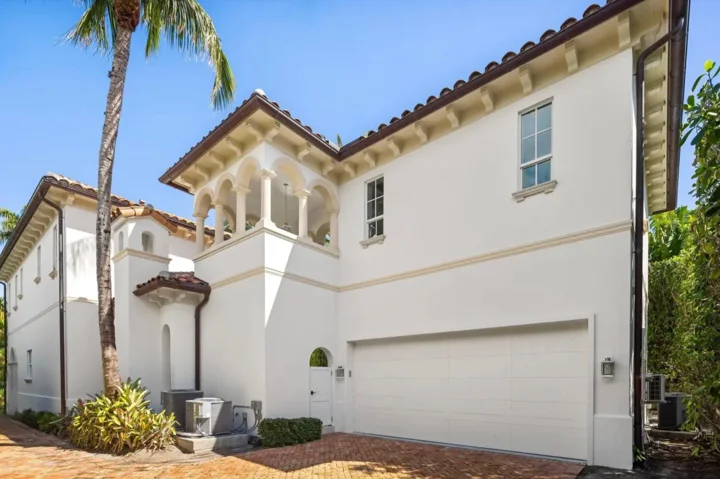 Clean driveway and garage apron of modern coastal Florida residence
