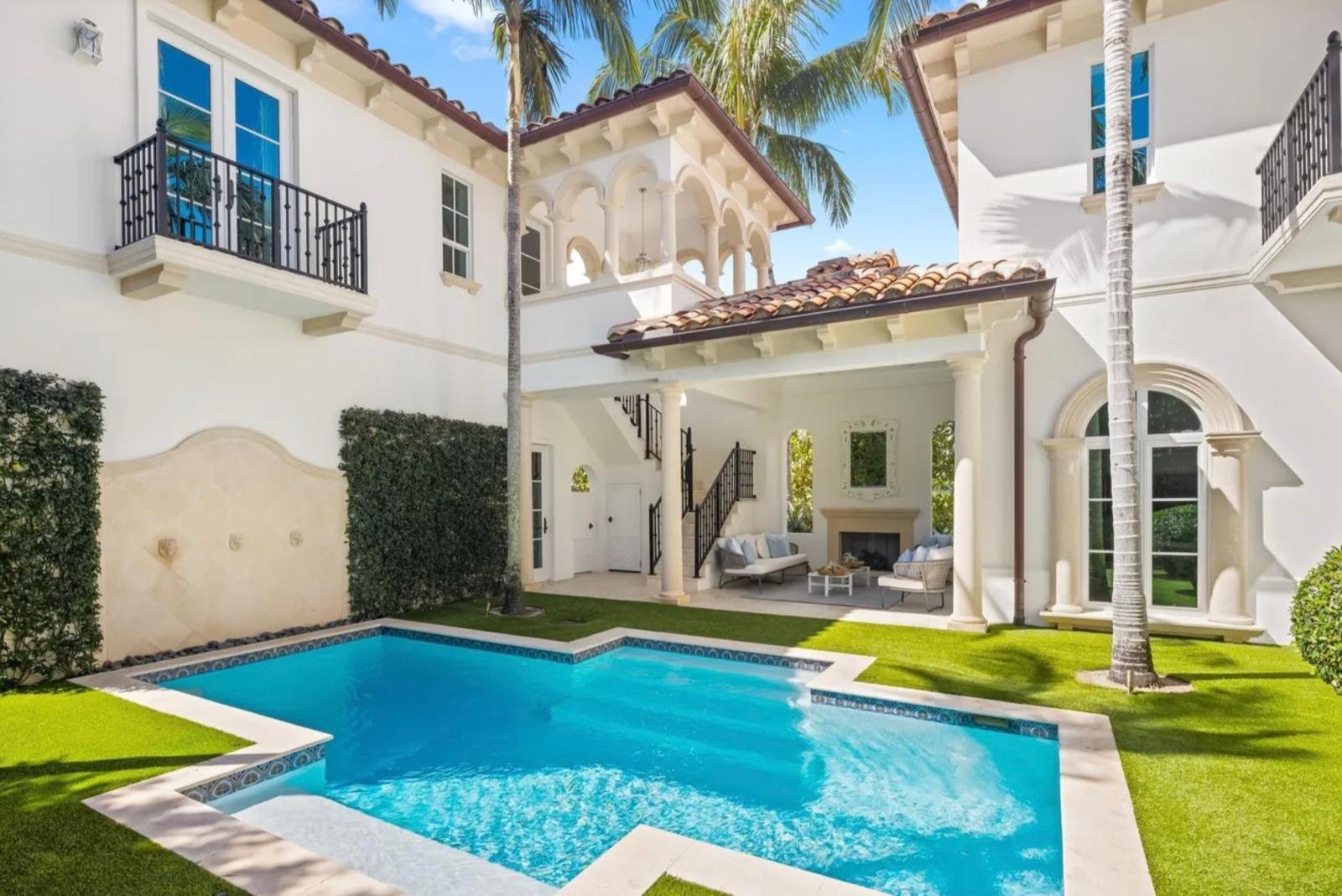 Finished courtyard exterior with refreshed walls surrounding a pool